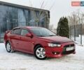 Красный Мицубиси Лансер, объемом двигателя 2 л и пробегом 172 тыс. км за 7750 $, фото 1 на Automoto.ua
