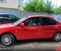 Красный Мицубиси Лансер, объемом двигателя 1.6 л и пробегом 255 тыс. км за 4600 $, фото 1 на Automoto.ua