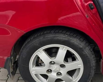 Красный Мицубиси Лансер, объемом двигателя 1.6 л и пробегом 176 тыс. км за 4300 $, фото 5 на Automoto.ua