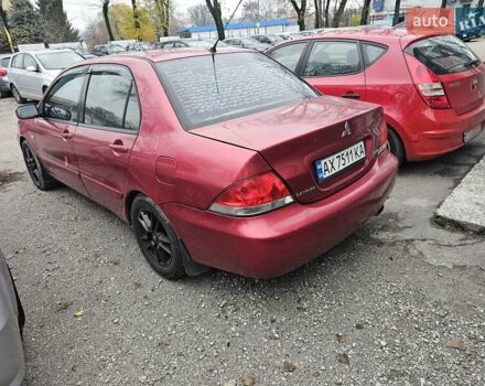 Червоний Міцубісі Lancer, об'ємом двигуна 1.6 л та пробігом 267 тис. км за 2999 $, фото 3 на Automoto.ua