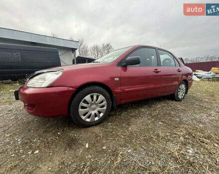 Красный Мицубиси Лансер, объемом двигателя 1.58 л и пробегом 280 тыс. км за 3250 $, фото 3 на Automoto.ua