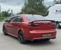Червоний Міцубісі Lancer, об'ємом двигуна 2 л та пробігом 184 тис. км за 5999 $, фото 3 на Automoto.ua
