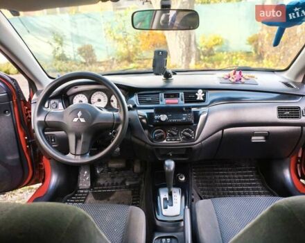 Красный Мицубиси Лансер, объемом двигателя 1.6 л и пробегом 214 тыс. км за 5000 $, фото 1 на Automoto.ua