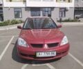 Красный Мицубиси Лансер, объемом двигателя 1.58 л и пробегом 145 тыс. км за 6500 $, фото 1 на Automoto.ua
