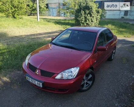 Червоний Міцубісі Lancer, об'ємом двигуна 1.6 л та пробігом 173 тис. км за 5500 $, фото 7 на Automoto.ua