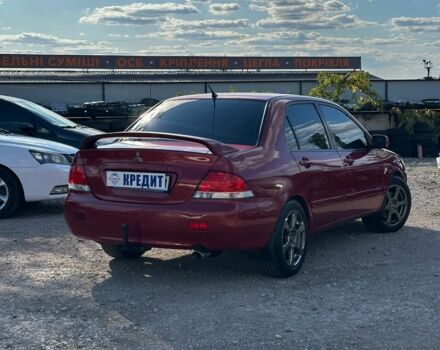 Красный Мицубиси Лансер, объемом двигателя 1.6 л и пробегом 230 тыс. км за 5300 $, фото 4 на Automoto.ua