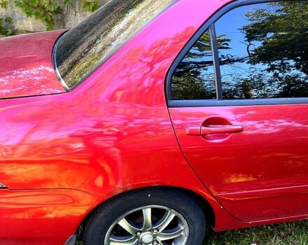 Красный Мицубиси Лансер, объемом двигателя 1.6 л и пробегом 344 тыс. км за 4000 $, фото 5 на Automoto.ua