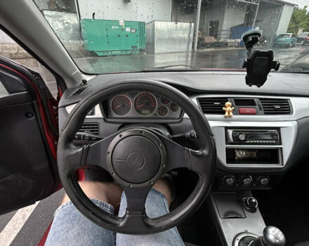 Красный Мицубиси Лансер, объемом двигателя 2 л и пробегом 210 тыс. км за 5200 $, фото 15 на Automoto.ua