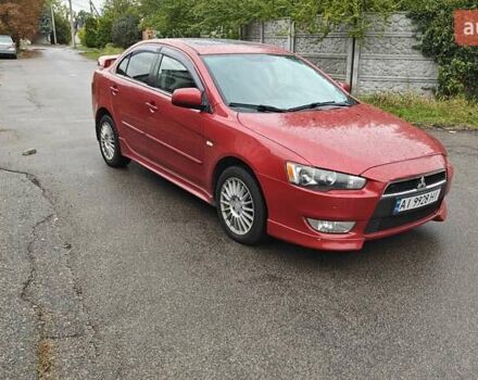 Червоний Міцубісі Lancer, об'ємом двигуна 2 л та пробігом 186 тис. км за 5600 $, фото 1 на Automoto.ua