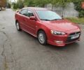 Червоний Міцубісі Lancer, об'ємом двигуна 2 л та пробігом 186 тис. км за 5600 $, фото 1 на Automoto.ua