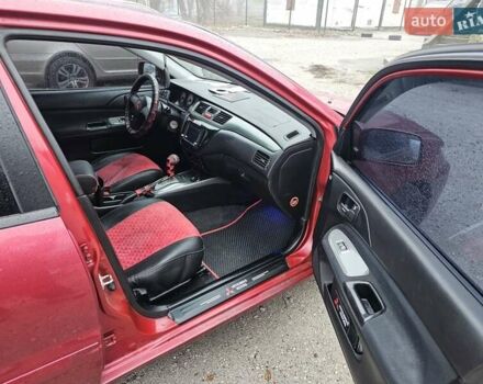 Червоний Міцубісі Lancer, об'ємом двигуна 1.6 л та пробігом 267 тис. км за 2999 $, фото 7 на Automoto.ua