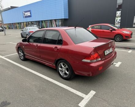 Красный Мицубиси Лансер, объемом двигателя 1.6 л и пробегом 285 тыс. км за 3650 $, фото 7 на Automoto.ua