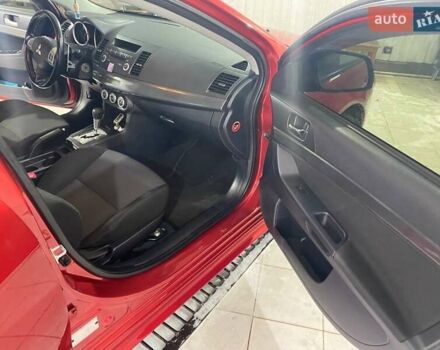 Красный Мицубиси Лансер, объемом двигателя 2 л и пробегом 66 тыс. км за 10000 $, фото 6 на Automoto.ua