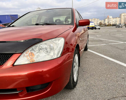 Червоний Міцубісі Lancer, об'ємом двигуна 1.6 л та пробігом 194 тис. км за 5500 $, фото 13 на Automoto.ua