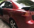 Червоний Міцубісі Lancer, об'ємом двигуна 2 л та пробігом 286 тис. км за 8500 $, фото 1 на Automoto.ua