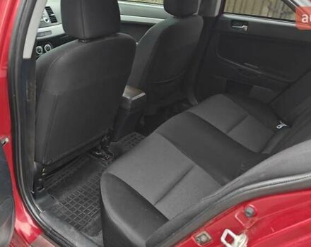 Червоний Міцубісі Lancer, об'ємом двигуна 2 л та пробігом 186 тис. км за 5600 $, фото 20 на Automoto.ua