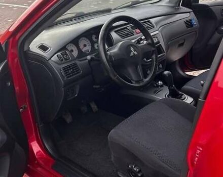 Красный Мицубиси Лансер, объемом двигателя 1.6 л и пробегом 176 тыс. км за 4300 $, фото 11 на Automoto.ua