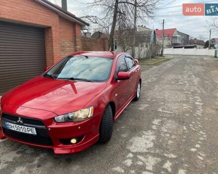 Красный Мицубиси Лансер, объемом двигателя 2 л и пробегом 66 тыс. км за 10000 $, фото 1 на Automoto.ua