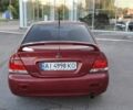 Красный Мицубиси Лансер, объемом двигателя 1.6 л и пробегом 400 тыс. км за 4199 $, фото 14 на Automoto.ua