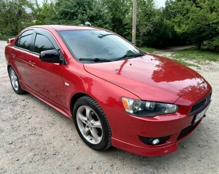 Червоний Міцубісі Lancer, об'ємом двигуна 2 л та пробігом 259 тис. км за 6500 $, фото 1 на Automoto.ua