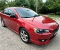 Червоний Міцубісі Lancer, об'ємом двигуна 2 л та пробігом 259 тис. км за 6500 $, фото 1 на Automoto.ua