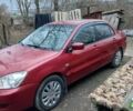 Красный Мицубиси Лансер, объемом двигателя 1.58 л и пробегом 350 тыс. км за 2500 $, фото 1 на Automoto.ua