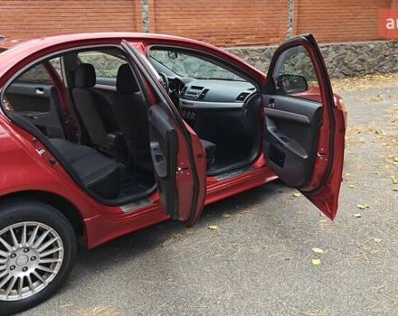 Міцубісі Lancer 2007 у Києві на Automoto.ua Червоний Міцубісі Lancer, об'ємом двигуна 2 л та пробігом 186 тис. км за 5600 $, фото 13 на Automoto.ua