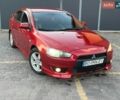 Красный Мицубиси Лансер, объемом двигателя 2 л и пробегом 299 тыс. км за 4999 $, фото 1 на Automoto.ua