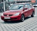Красный Мицубиси Лансер, объемом двигателя 1.58 л и пробегом 222 тыс. км за 4500 $, фото 1 на Automoto.ua