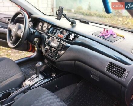 Красный Мицубиси Лансер, объемом двигателя 1.6 л и пробегом 214 тыс. км за 5000 $, фото 6 на Automoto.ua