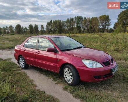 Красный Мицубиси Лансер, объемом двигателя 1.58 л и пробегом 264 тыс. км за 3900 $, фото 7 на Automoto.ua