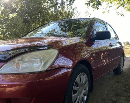 Красный Мицубиси Лансер, объемом двигателя 1.6 л и пробегом 277 тыс. км за 3299 $, фото 1 на Automoto.ua