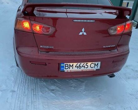 Червоний Міцубісі Lancer, об'ємом двигуна 2 л та пробігом 171 тис. км за 7500 $, фото 3 на Automoto.ua