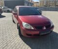Красный Мицубиси Лансер, объемом двигателя 1.6 л и пробегом 196 тыс. км за 5200 $, фото 4 на Automoto.ua