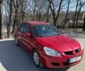 Красный Мицубиси Лансер, объемом двигателя 1.58 л и пробегом 165 тыс. км за 4700 $, фото 1 на Automoto.ua
