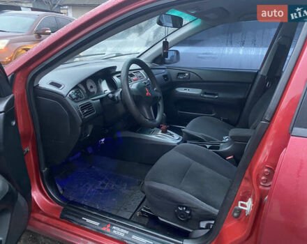 Красный Мицубиси Лансер, объемом двигателя 1.58 л и пробегом 269 тыс. км за 3899 $, фото 6 на Automoto.ua