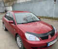 Червоний Міцубісі Lancer, об'ємом двигуна 1.58 л та пробігом 151 тис. км за 5600 $, фото 10 на Automoto.ua