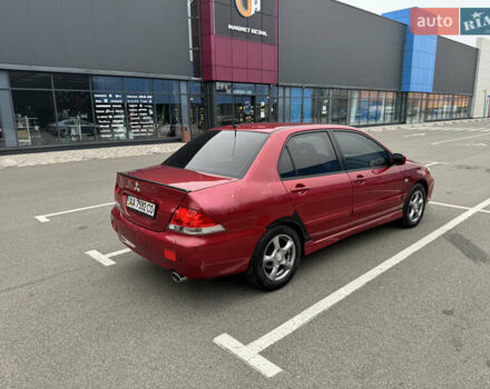 Красный Мицубиси Лансер, объемом двигателя 1.58 л и пробегом 285 тыс. км за 3650 $, фото 6 на Automoto.ua