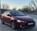 Червоний Міцубісі Lancer, об'ємом двигуна 2 л та пробігом 230 тис. км за 5200 $, фото 1 на Automoto.ua