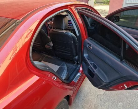 Красный Мицубиси Лансер, объемом двигателя 2 л и пробегом 274 тыс. км за 6000 $, фото 2 на Automoto.ua