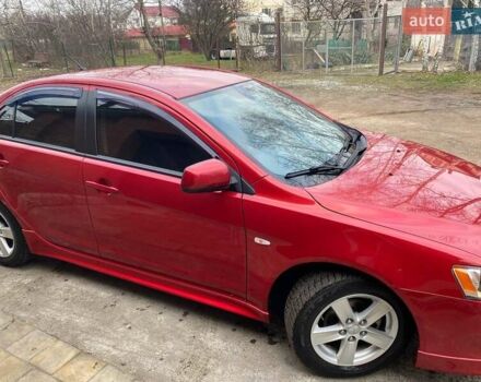 Красный Мицубиси Лансер, объемом двигателя 2 л и пробегом 66 тыс. км за 10000 $, фото 2 на Automoto.ua