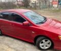 Красный Мицубиси Лансер, объемом двигателя 2 л и пробегом 66 тыс. км за 10000 $, фото 2 на Automoto.ua