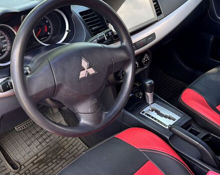 Красный Мицубиси Лансер, объемом двигателя 1.5 л и пробегом 145 тыс. км за 6500 $, фото 6 на Automoto.ua