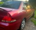 Червоний Міцубісі Lancer, об'ємом двигуна 1.6 л та пробігом 185 тис. км за 3900 $, фото 1 на Automoto.ua