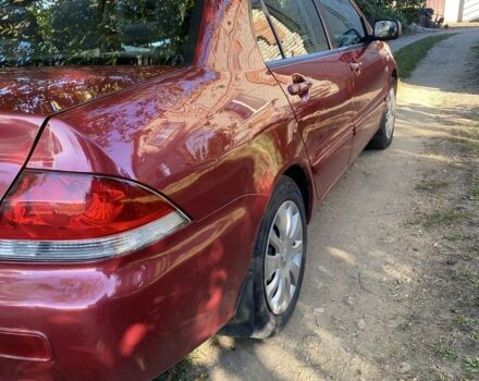 Красный Мицубиси Лансер, объемом двигателя 1.6 л и пробегом 277 тыс. км за 3299 $, фото 11 на Automoto.ua