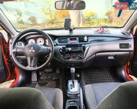 Красный Мицубиси Лансер, объемом двигателя 1.6 л и пробегом 214 тыс. км за 5000 $, фото 7 на Automoto.ua