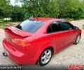 Червоний Міцубісі Lancer, об'ємом двигуна 2 л та пробігом 259 тис. км за 6500 $, фото 1 на Automoto.ua