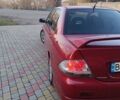 Червоний Міцубісі Lancer, об'ємом двигуна 2 л та пробігом 265 тис. км за 4300 $, фото 13 на Automoto.ua