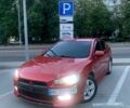 Красный Мицубиси Лансер, объемом двигателя 2 л и пробегом 330 тыс. км за 3300 $, фото 1 на Automoto.ua