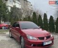 Красный Мицубиси Лансер, объемом двигателя 2 л и пробегом 328 тыс. км за 2950 $, фото 1 на Automoto.ua